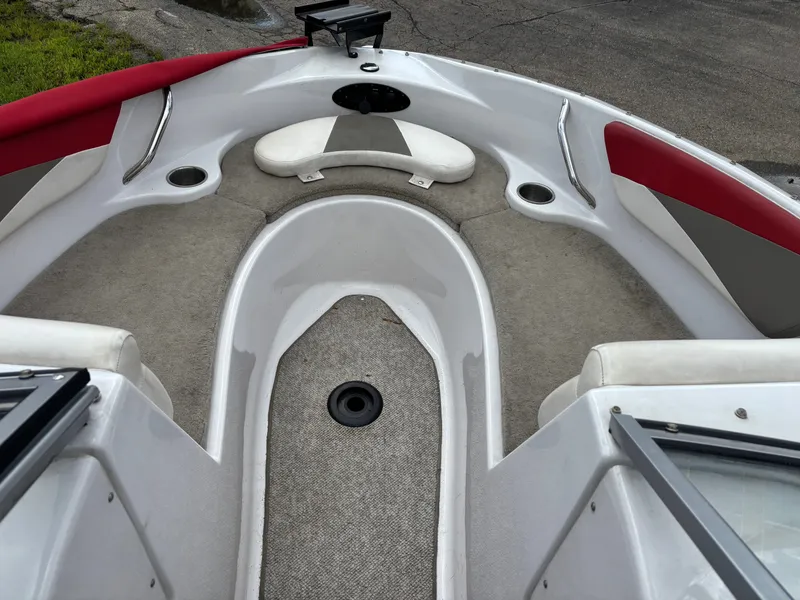 Slide: The Image of Interior view of a 2013 Glastron 205 MXSF boat with red and gray interior. - 6