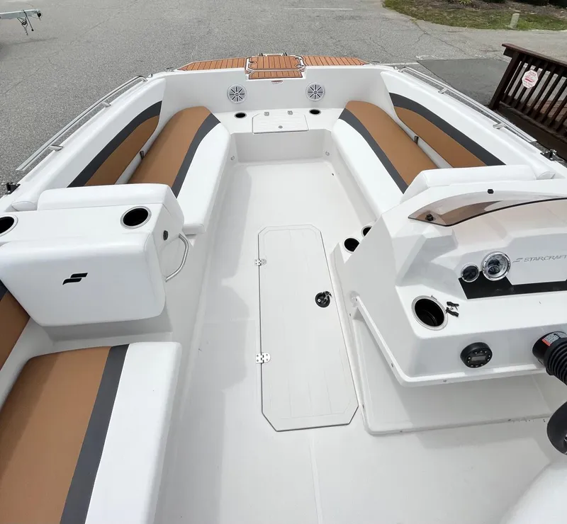 Slide: The Image of 2024 Starcraft SVX 171 boat interior with tan and white seating. - 6