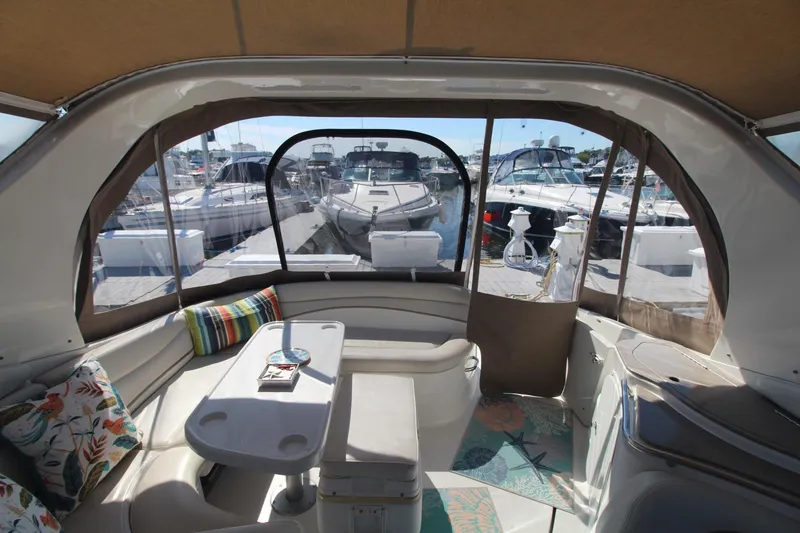 Slide: The Image of Interior view of 2004 Larson 370 Cabrio yacht with seating and table. - 10