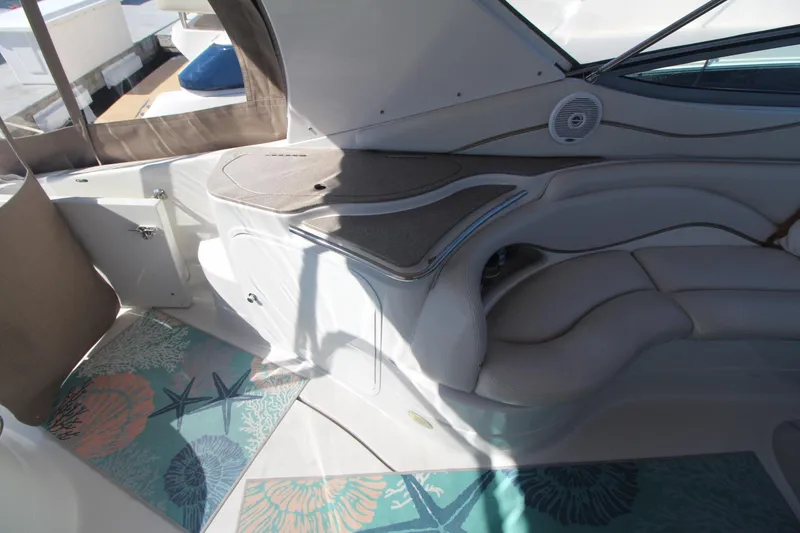 Slide: The Image of Interior of a 2004 Larson 370 Cabrio boat with seating and decorative flooring. - 11