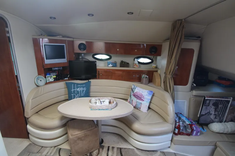 Slide: The Image of Interior of 2004 Larson 370 Cabrio yacht with cozy seating and modern amenities. - 19