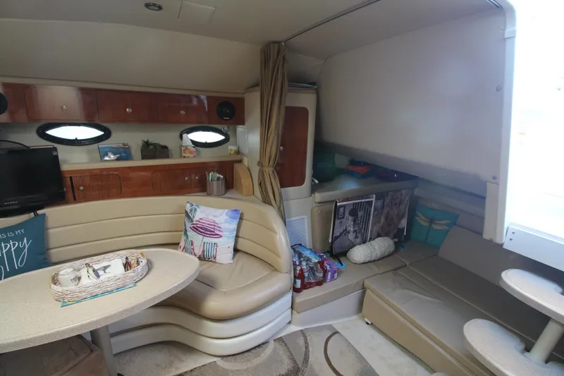 Slide: The Image of Interior of 2004 Larson 370 Cabrio yacht with cozy seating and modern amenities. - 20