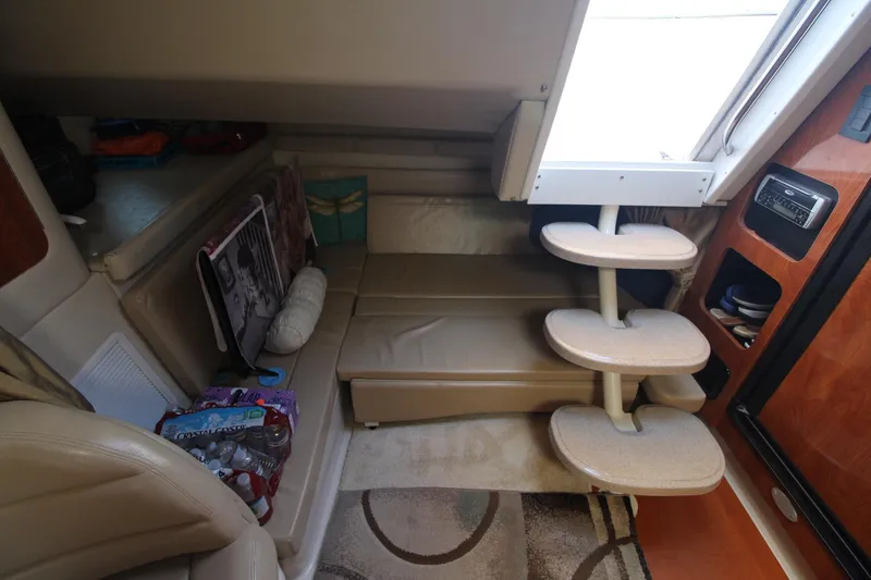 Slide: The Image of Interior of 2004 Larson 370 Cabrio boat with seating and storage area. - 21