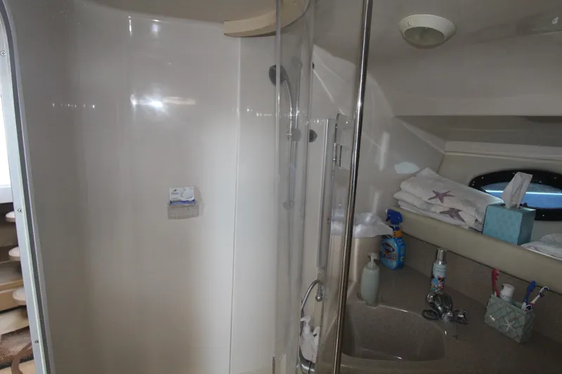 Slide: The Image of Bathroom interior of 2004 Larson 370 Cabrio boat with shower and sink area. - 30