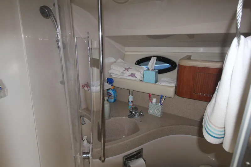 Slide: The Image of Bathroom interior of 2004 Larson 370 Cabrio yacht with shower and toiletries. - 32