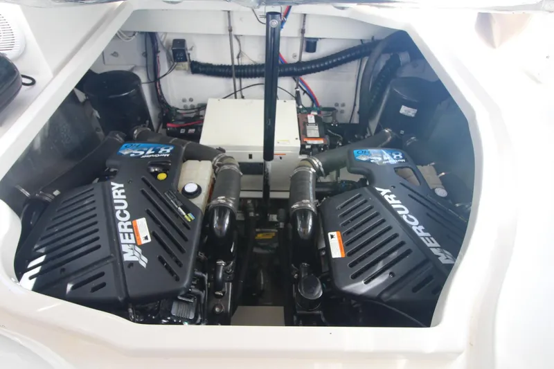 Slide: The Image of Engine compartment of a 2004 Larson 370 Cabrio with dual Mercury engines. - 35