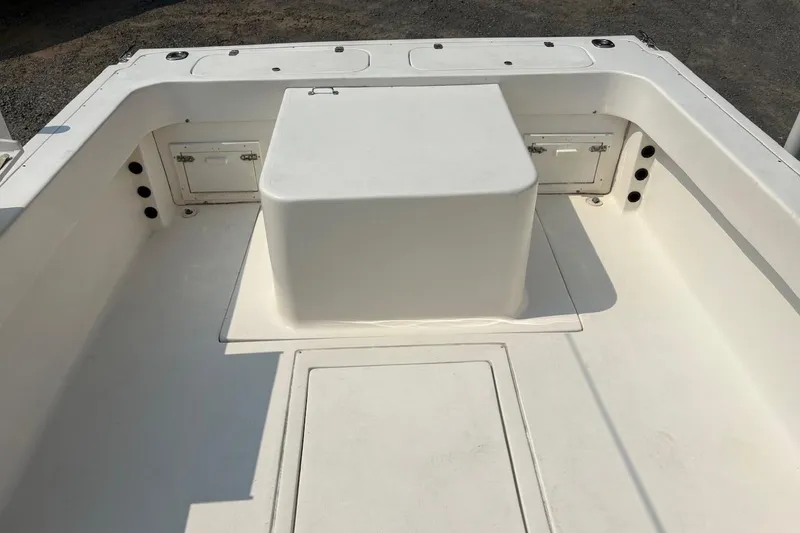 Slide: The Image of 1995 Baha Cruisers 240 Walkaround boat interior with storage compartments and seating area. - 10