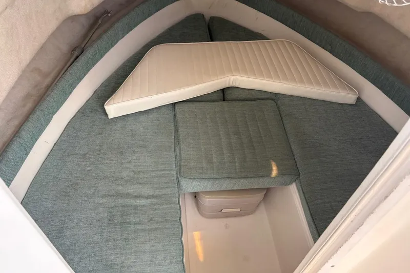 Slide: The Image of Interior cabin of 1995 Baha Cruisers 240 Walkaround with cushioned seating. - 7
