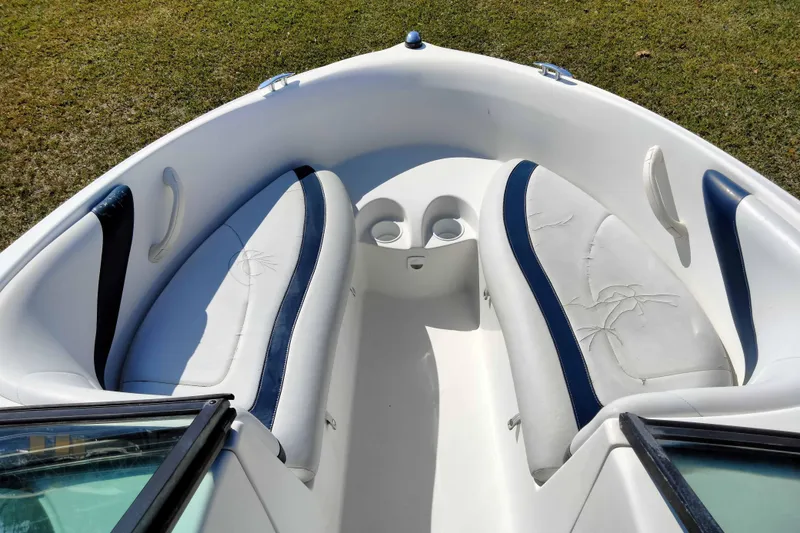 Slide: The Image of 2003 Sea-Doo Utopia 185 boat interior with white and blue seating. - 12