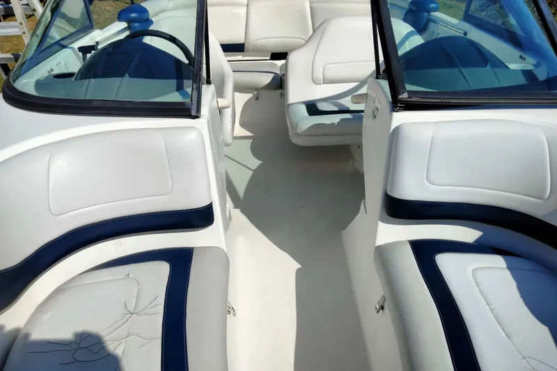 Slide: The Image of 2003 Sea-Doo Utopia 185 boat interior with white and blue seating. - 13