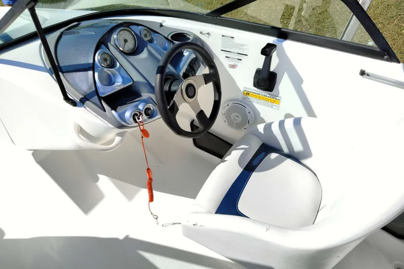 Slide: The Image of 2003 Sea-Doo Utopia 185 boat cockpit with steering wheel and control panel. - 16