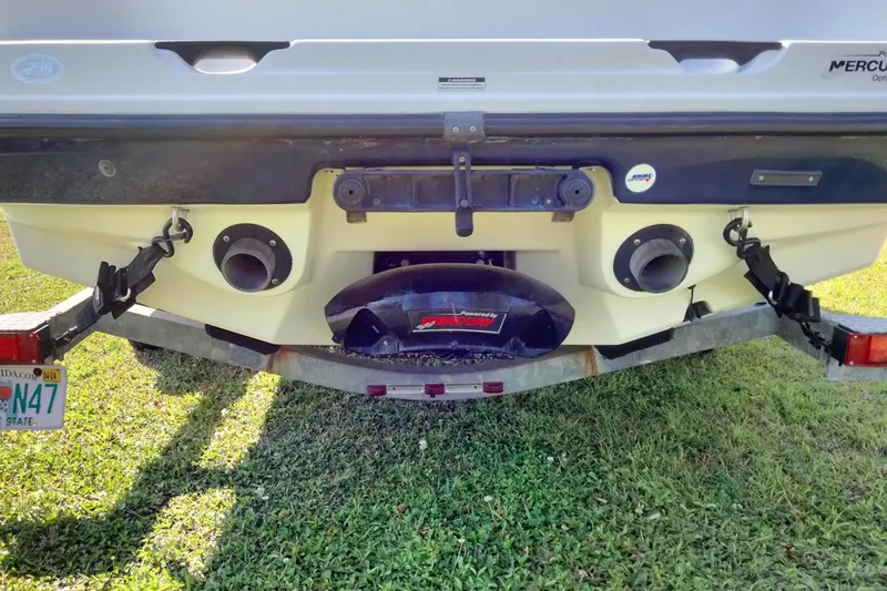 Slide: The Image of Rear view of 2003 Sea-Doo Utopia 185 boat on trailer, showing exhaust and license plate. - 8