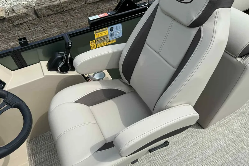 Slide: The Image of 2026 Bentley Pontoons Legacy 223 Navigator 3/4Tube captain's chair and control panel. - 13