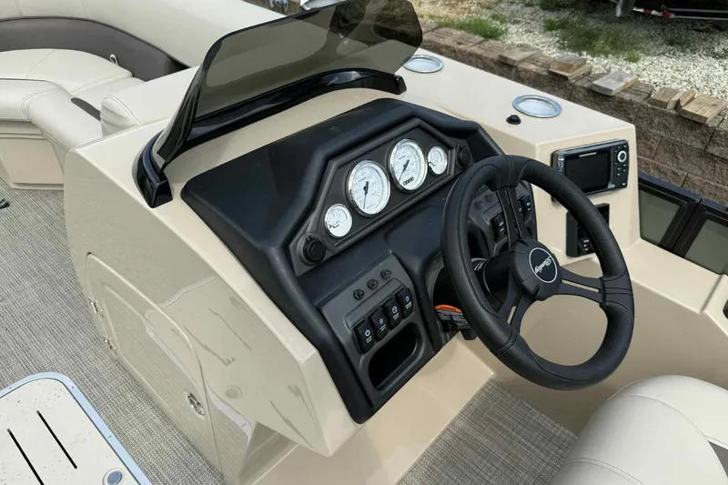 Slide: The Image of 2026 Bentley Pontoons Legacy 223 Navigator dashboard with steering wheel and gauges. - 14