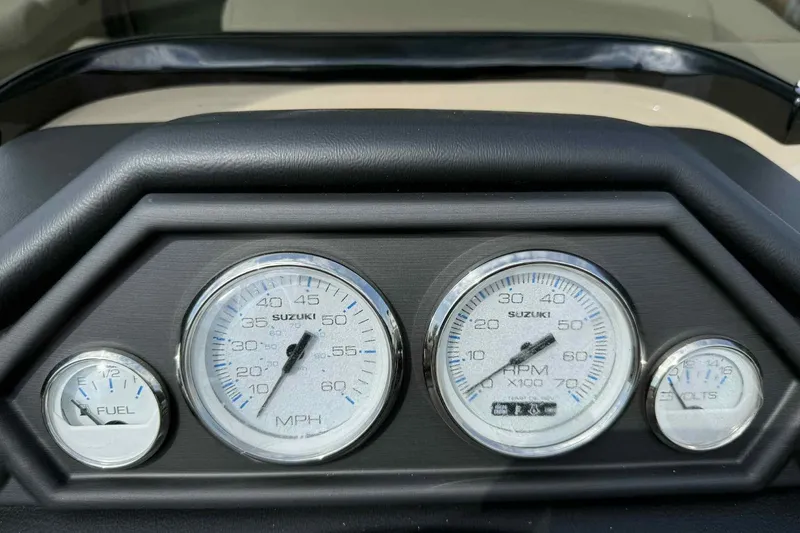 Slide: The Image of Dashboard gauges of 2026 Bentley Pontoons Legacy 223 Navigator, showing speed, RPM, fuel, and volts. - 16