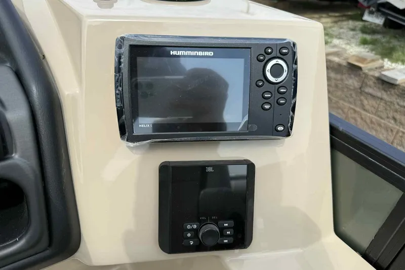 Slide: The Image of 2026 Bentley Pontoons Legacy 223 Navigator dashboard with Humminbird and JBL controls. - 17