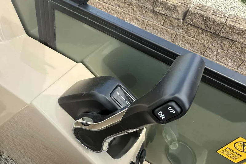Slide: The Image of Close-up of throttle control in 2026 Bentley Pontoons Legacy 223 Navigator 3/4Tube. - 18