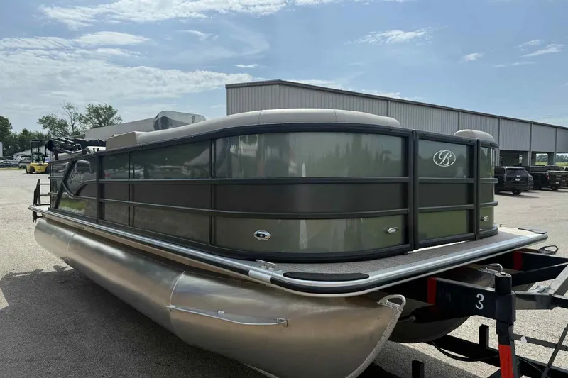 Slide: The Image of 2026 Bentley Pontoons Legacy 223 Navigator 3/4Tube on trailer, parked outdoors. - 2