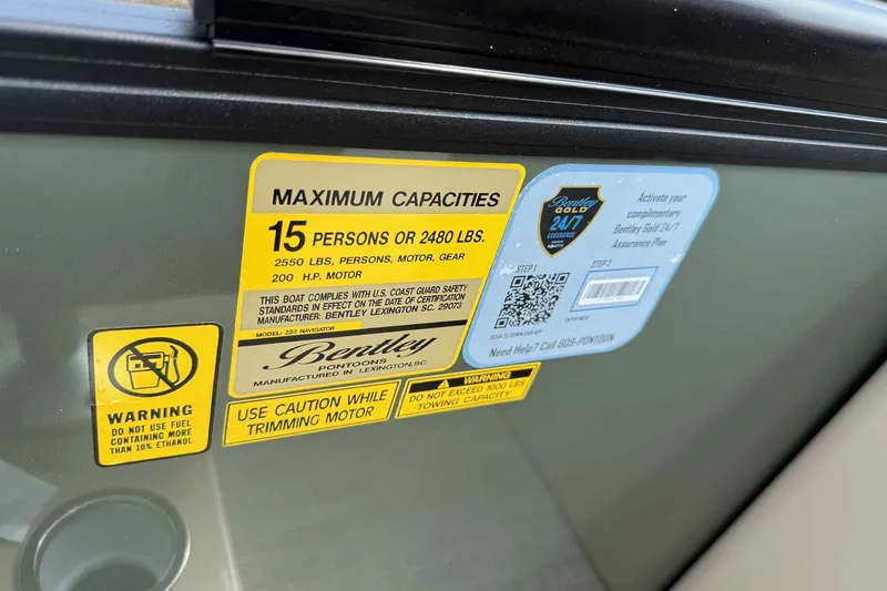 Slide: The Image of Sticker on 2026 Bentley Pontoons Legacy 223 Navigator, showing maximum capacity and safety warnings. - 20