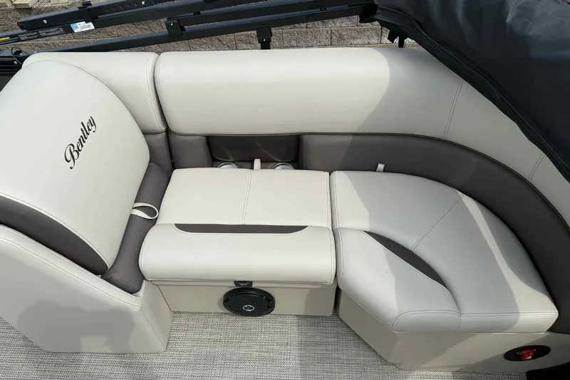 Slide: The Image of 2026 Bentley Pontoons Legacy 223 Navigator interior seating, featuring luxurious beige upholstery. - 22