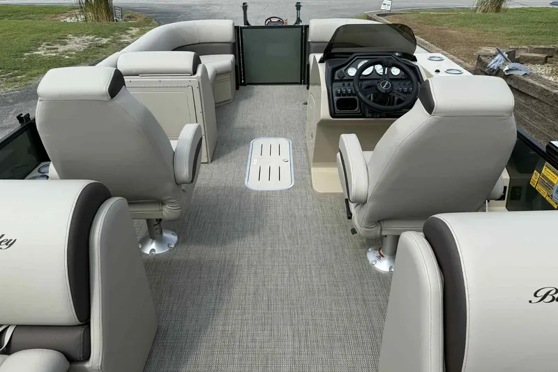Slide: The Image of 2026 Bentley Pontoons Legacy 223 Navigator interior with plush seating and modern helm. - 24