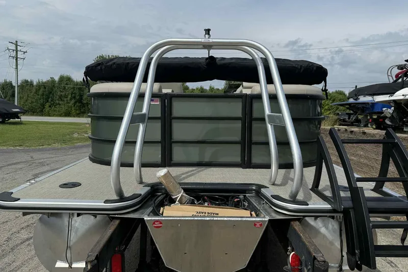 Slide: The Image of 2026 Bentley Pontoons Legacy 223 Navigator 3/4Tube, rear view with ladder and deck. - 4