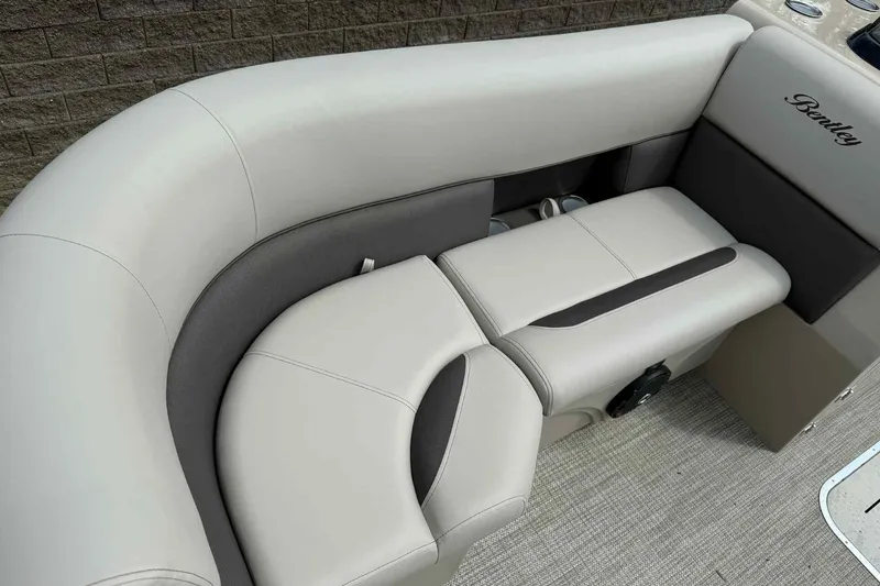 Slide: The Image of 2026 Bentley Pontoons Legacy 223 Navigator 3/4Tube interior seating, featuring luxurious beige upholstery. - 8
