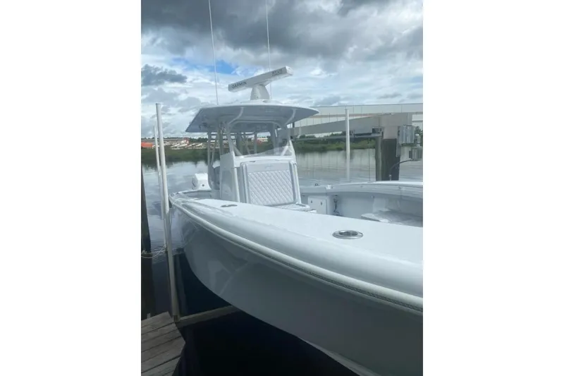 Slide: The Image of 2022 Yellowfin 32 boat docked under cloudy sky. - 10