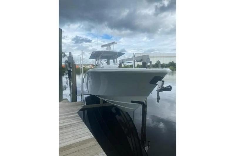 Slide: The Image of 2022 Yellowfin 32 boat docked on a cloudy day. - 9