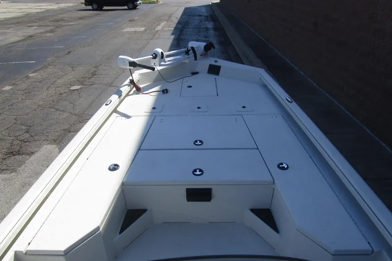 Slide: The Image of 2025 Ranger RB210 boat deck with storage compartments and trolling motor. - 10