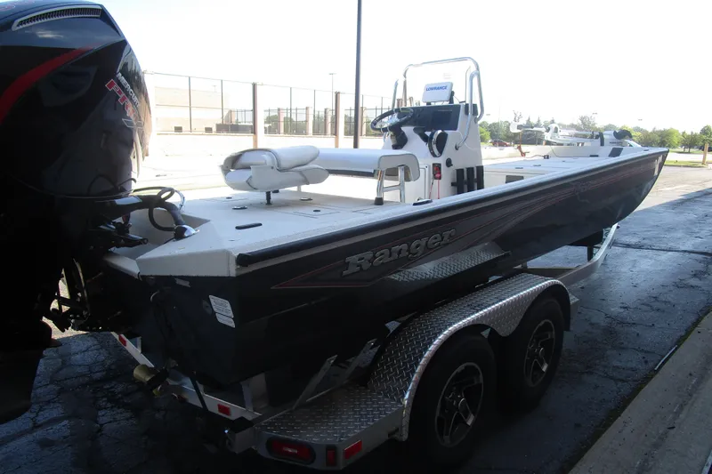 Slide: The Image of 2025 Ranger RB210 boat on trailer, featuring sleek design and powerful engine. - 6