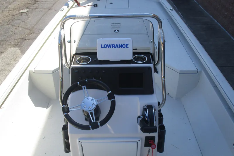 Slide: The Image of 2025 Ranger RB210 boat console with Lowrance navigation system and steering wheel. - 8