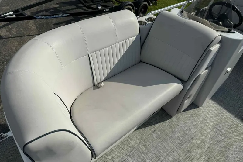 Slide: The Image of Luxurious seating on 2019 Qwest 816 Luxury Series boat, featuring plush gray upholstery. - 10
