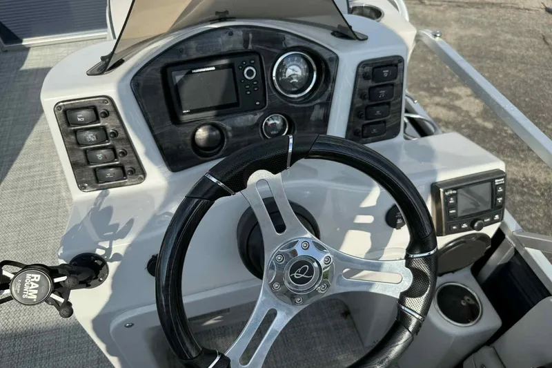 Slide: The Image of Steering console of 2019 Qwest 816 Luxury Series boat with navigation controls. - 13