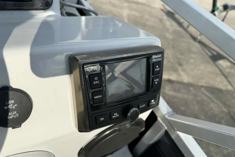 Slide: The Image of Control panel of a 2019 Qwest 816 Luxury Series boat with Bluetooth and USB input. - 15