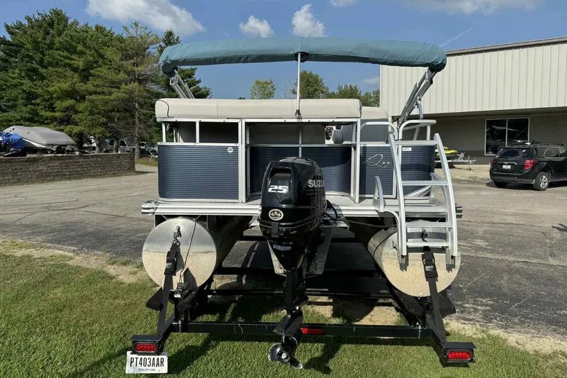 Slide: The Image of 2019 Qwest 816 Luxury Series pontoon boat with Suzuki motor on trailer. - 5
