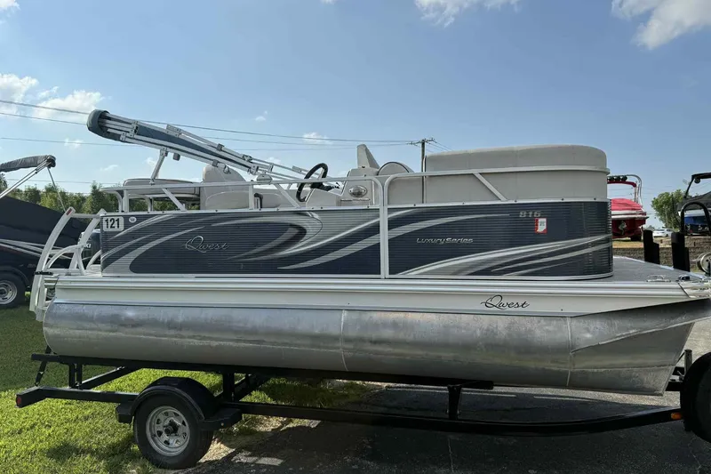 Slide: The Image of 2019 Qwest 816 Luxury Series pontoon boat on trailer, side view, sunny day. - 7