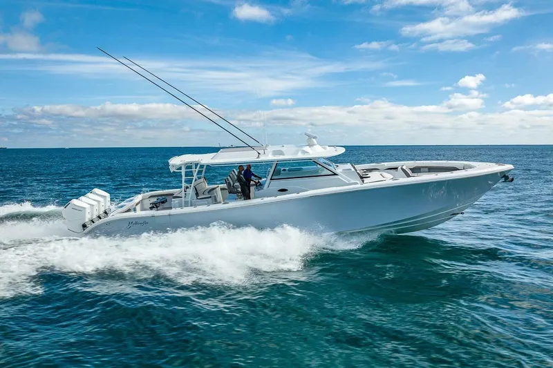 The Image of 2024 Yellowfin 54 Offshore boat cruising on open ocean under clear blue sky. - 1