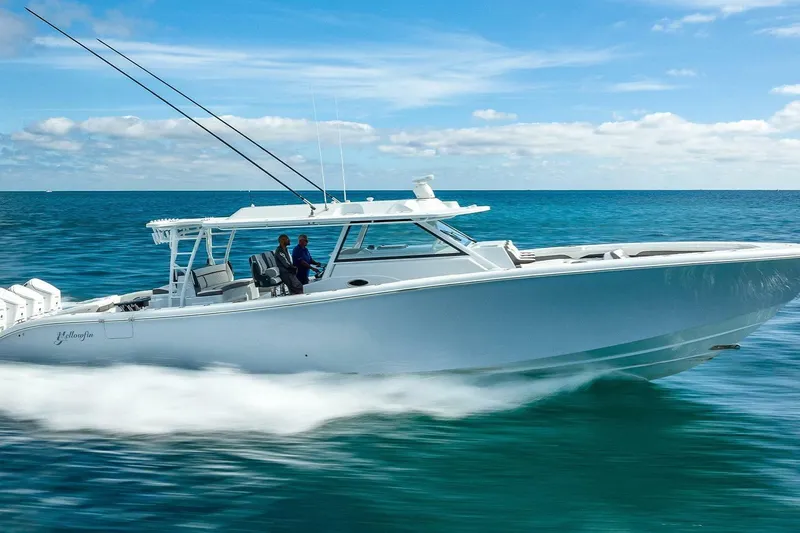 Slide: The Image of 2024 Yellowfin 54 Offshore boat cruising on open ocean waters. - 2
