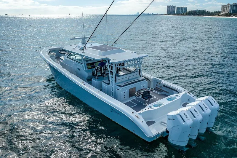 Slide: The Image of 2024 Yellowfin 54 Offshore boat cruising on open water, showcasing sleek design and powerful engines. - 6