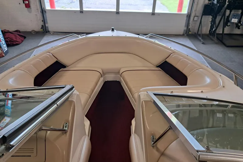 Slide: The Image of 1996 Sea Ray 190 Bow Rider interior with beige seating and glass windshield. - 6