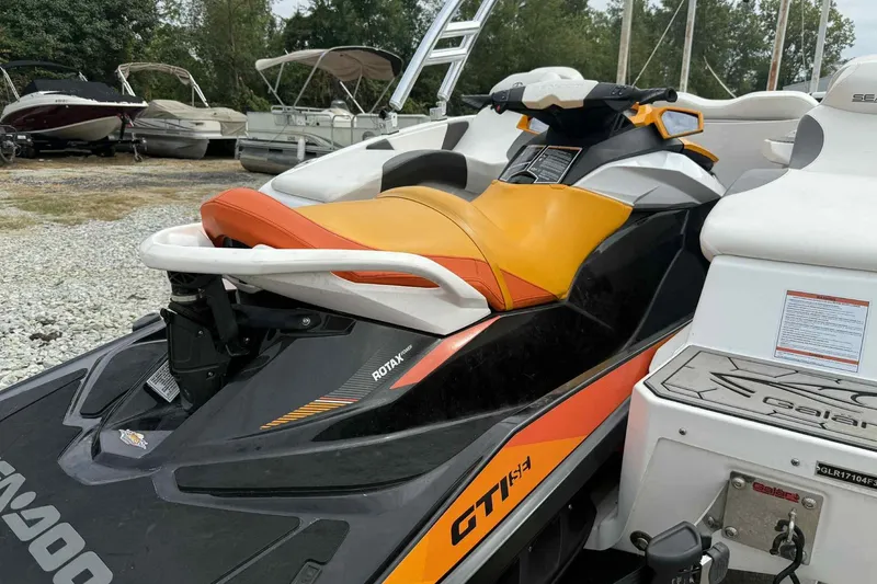 Slide: The Image of 2024 Galar Boats Typhoon with Seadoo GTI SE 155, vibrant orange and black design. - 12
