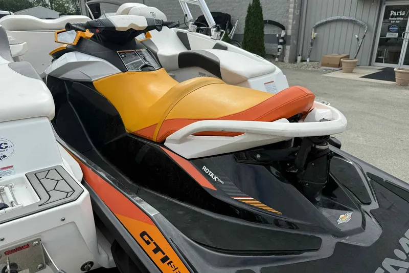 Slide: The Image of 2024 Galar Boats Typhoon with Seadoo GTI SE 155, featuring vibrant orange seat. - 13