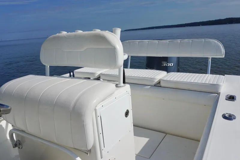Slide: The Image of 2009 Regulator 24 FS boat interior with white seating and Yamaha 300 engine. - 12