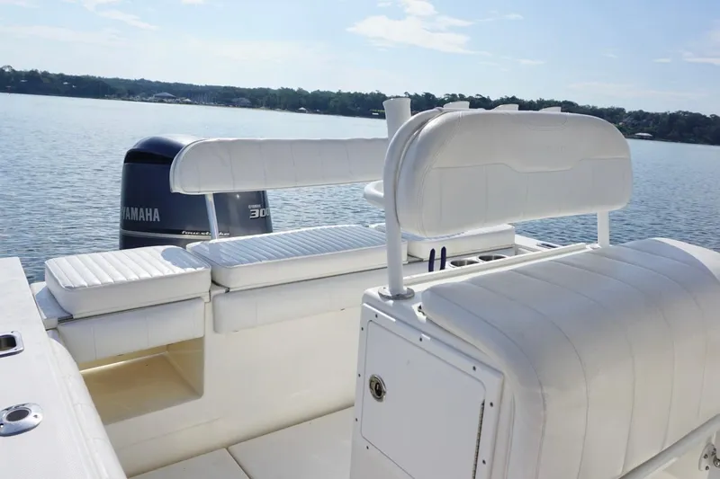 Slide: The Image of 2009 Regulator 24 FS boat with Yamaha 300 engine on calm water. - 14