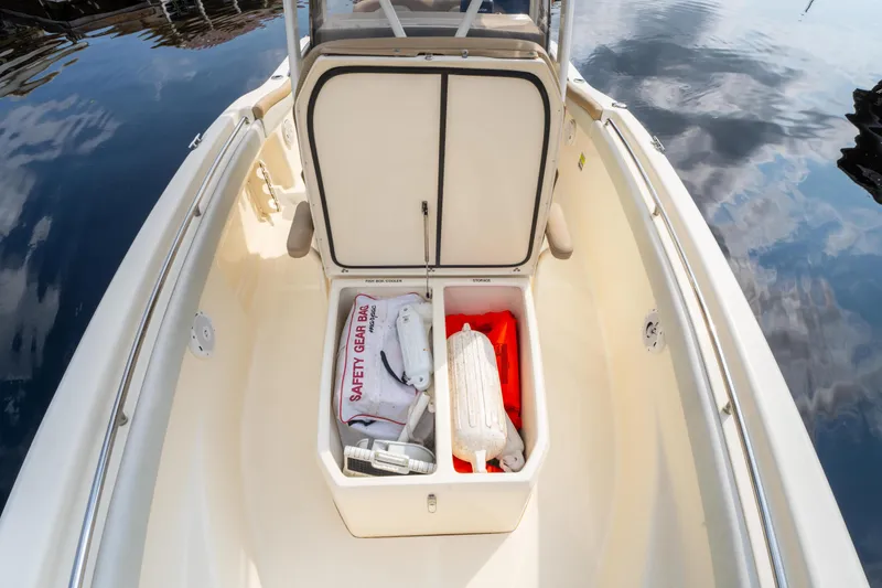 Slide: The Image of 2015 Scout 210 XSF boat storage with safety gear and equipment. - 10