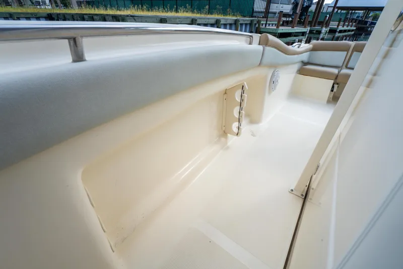 Slide: The Image of 2015 Scout 210 XSF boat interior with seating and storage compartments. - 14