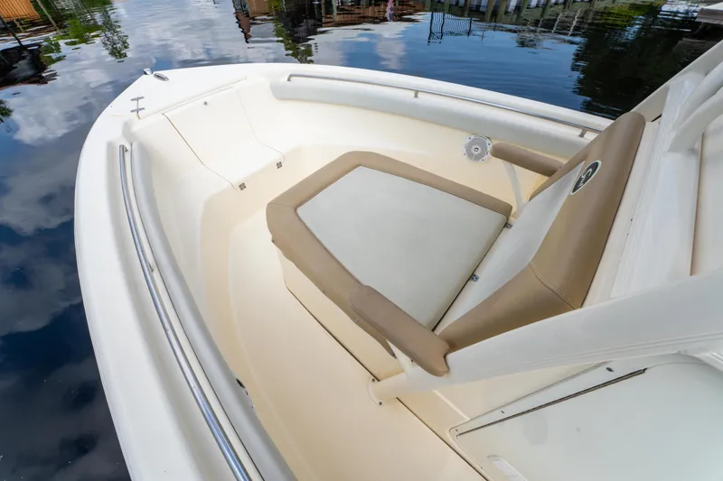 Slide: The Image of 2015 Scout 210 XSF boat interior with cushioned seating and sleek design. - 16