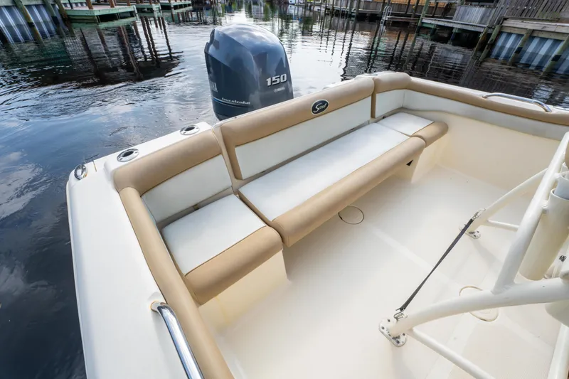 Slide: The Image of 2015 Scout 210 XSF boat interior with seating and Yamaha outboard motor. - 24