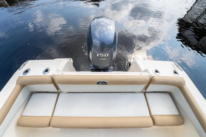 Slide: The Image of 2015 Scout 210 XSF boat with Yamaha 150 engine on calm water. - 25